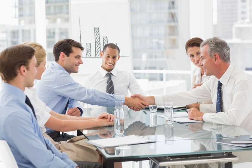 Business people making a deal at a meeting in the office